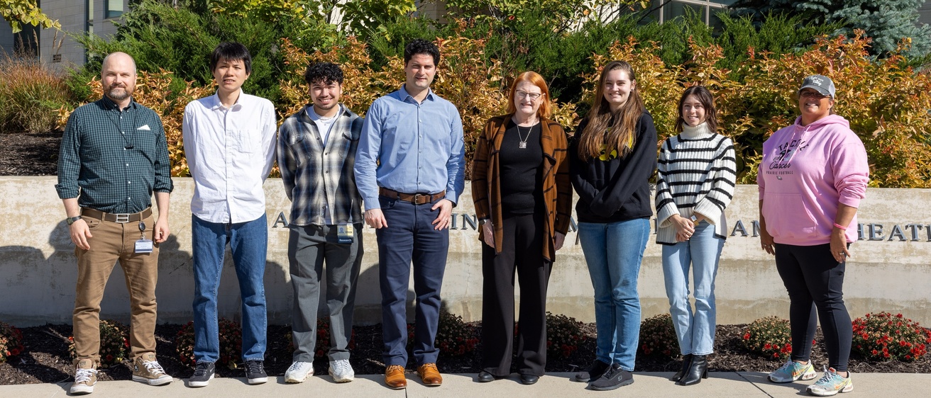 Kathleen Sluka with team