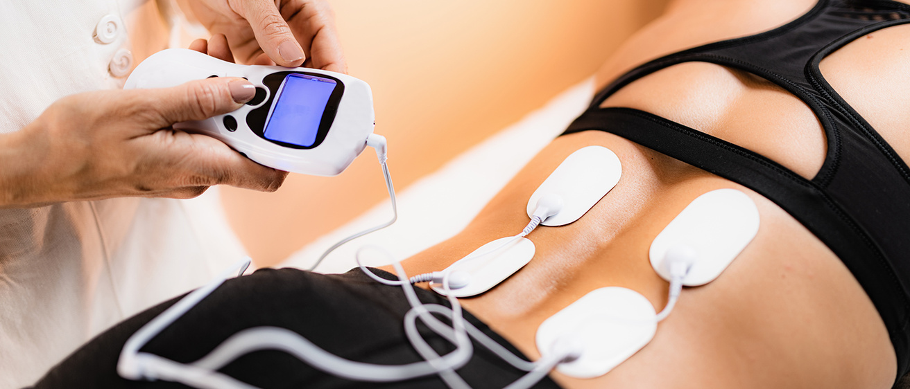 Picture of TENS unit on woman's back